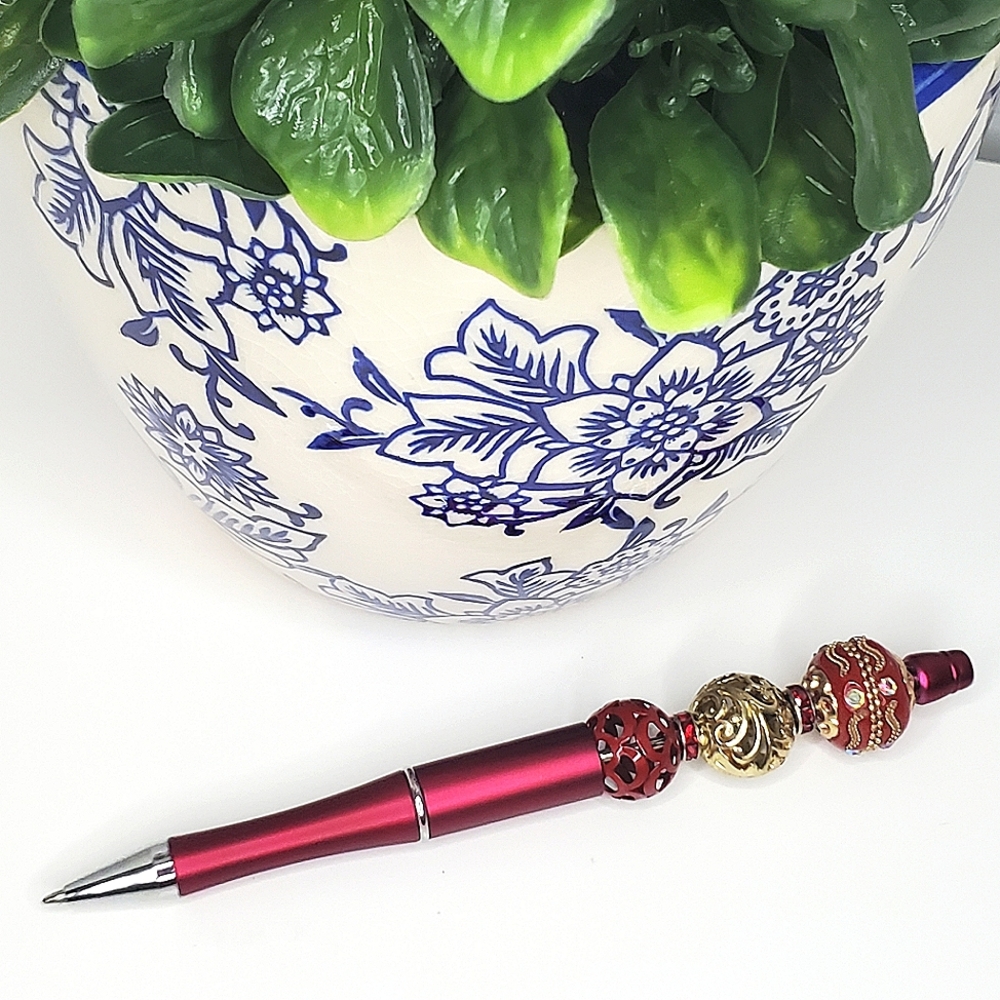 LADY IN RED BEADED PEN
